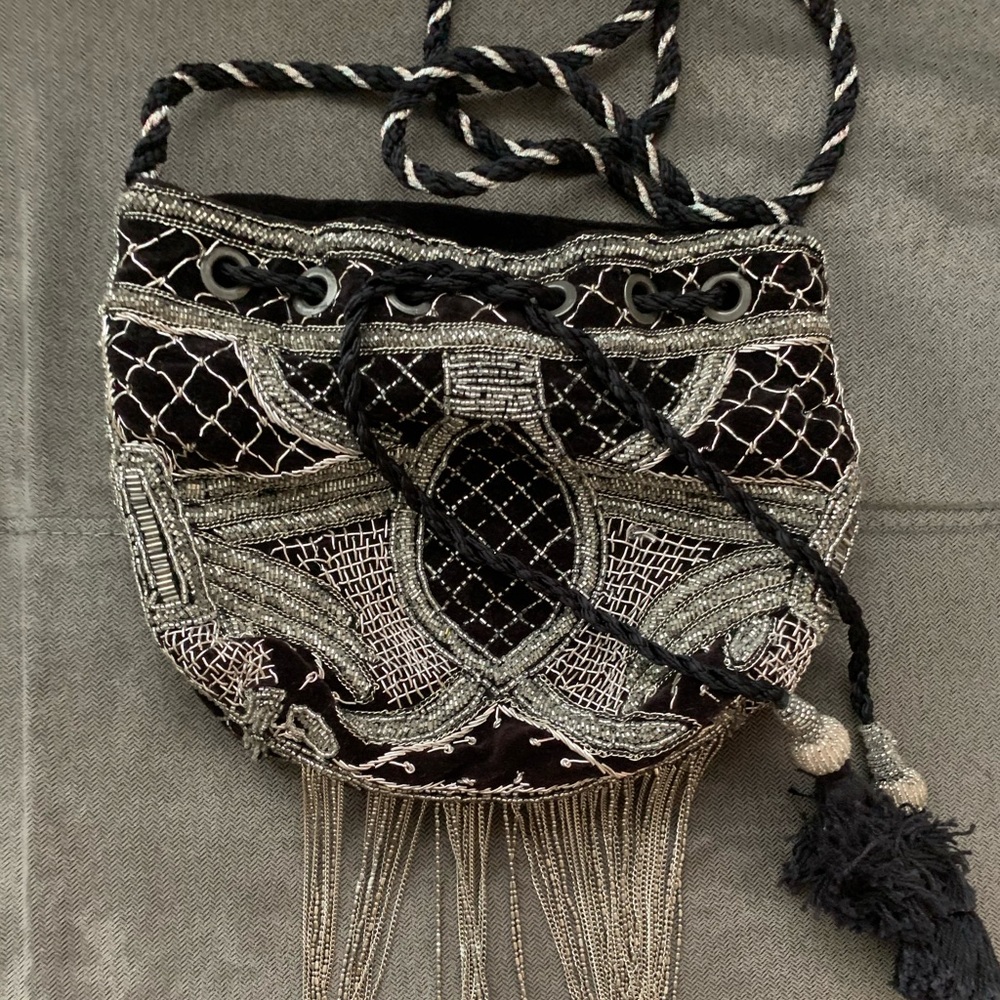 Cute black bucket bag with silver detailing.